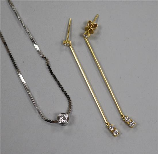 A pair of 18ct gold and diamond earrings and a diamond solitaire and platinum pendant on 8ct white gold chain.